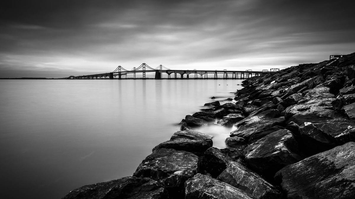 The Chesapeake Bay Bridge at dusk, in black and white